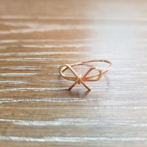 Delicate gold bow ring